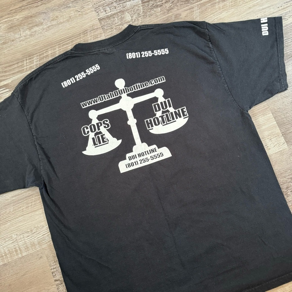 DUI Cops Lie Hotline Utah tourist t shirt
Slight faded black double sided rap